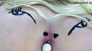 Pink asshole sucks lollipop in sheer red