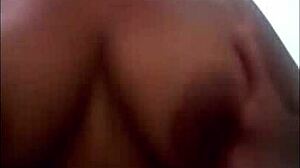 Pregnant latina masturbates while watching voyeur cum on her big tits.