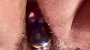 I masturbate with glass dildo on my hairy pussy close up