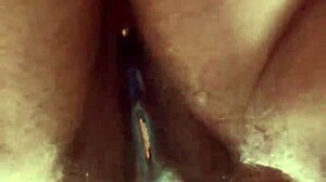 I masturbate with glass dildo on my hairy pussy close up