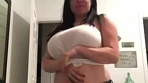 tattooed milf with big tits does a homemade striptease, ripping clothes off