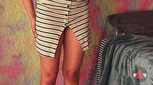 Lifting Her Skirt To Reveal Thighs In A Playful Moment