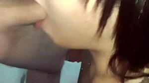 Transsexual sucks young client's pink dick in apartment for sensual encounter.