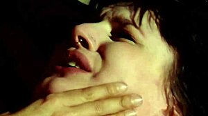 Suspended lesbian whipped and banged with strapon.