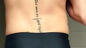 i'm the sexy guy shaving in black beach shorts