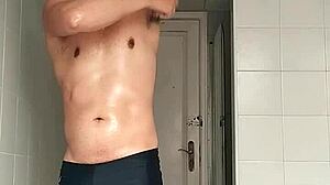 i'm the sexy guy shaving in black beach shorts