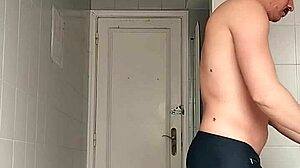 i'm the sexy guy shaving in black beach shorts