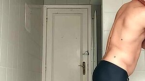 i'm the sexy guy shaving in black beach shorts