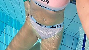 Blonde Plays with Wet Pussy in Public Pool