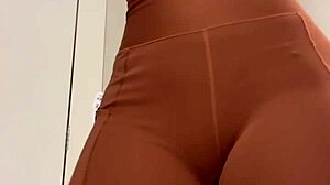 Beautiful Brazilian wife tries on clothes in the dressing room