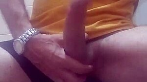 Hey, check out this guy jerking off and cumming hard in the bathroom 😏💦