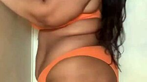 check out this horny ebony milf slut in bikini dancing with big tits ass boobs natural tits big ass whore moves