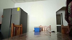 the maintenance man fixes fridge as housewife flashes vagina on desk