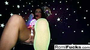 romi plays with a disco ball before stuffing and toying her pussy