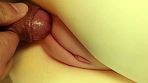 She lay there hairless and cute as I fingered her big pussy close-up.