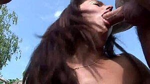 Christine O'Hara as brunette milf enjoys shaved pussy fucking outdoors by the pool with her man in 3some action
