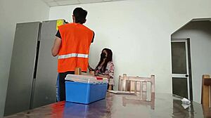 the maintenance man fixes fridge as housewife flashes vagina on desk