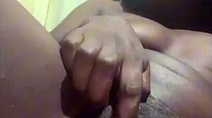 Black babe controls her pretty young pussy alone