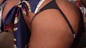 Ebony bends over with huge ass spreading wide