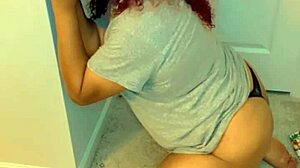 Crossdresser drops to knees and sucks a big black cock dildo in transsexual play