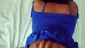 I love showing off my beautiful big ass in this tight blue dress while lying on the bed.