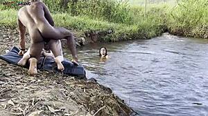 Outdoor Sunbathing Sex by River with Two Hot Babes Sucking and Creampie