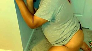 Crossdresser drops to knees and sucks a big black cock dildo in transsexual play