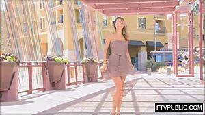 this blonde goes out in a short skirt flashing her nude body on the street. she teases with upskirt views during outdoor public exhibition.