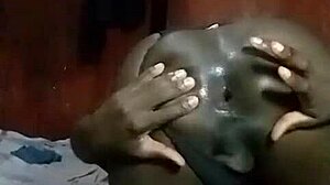 Horny Kenyan crossdresser strips down and fingers wide-open asshole in solo play.
