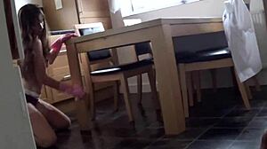 Mrs Scarlet teases in kitchen with stockings and heels during subtle underwear voyeur moment.