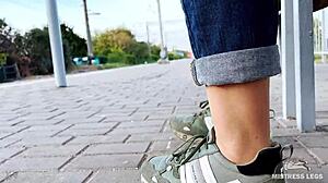 tan nylon soles with blue jeans teasing on the bench outdoors 😘