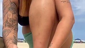 The young guy hadn't even fucked her swollen pussy yet when he suggested bringing a friend to join them on the beach for more.