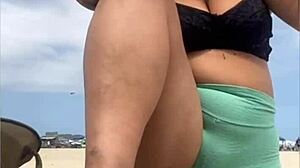 The young guy hadn't even fucked her swollen pussy yet when he suggested bringing a friend to join them on the beach for more.