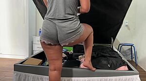 cute mexican wife flashes big ass in panties and shorts while arranging trunk in bedroom