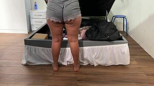 cute mexican wife flashes big ass in panties and shorts while arranging trunk in bedroom