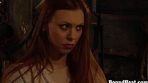 busty lesbian slave with big natural boobs tied up and intimately touched by dominant mistress in bondage