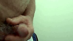 Rustyas1 masturbates solo in public toilet.