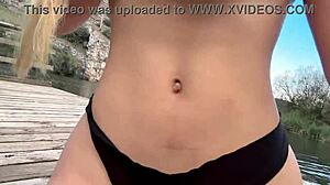 Blonde babe gropes big natural tits and squirts in forest