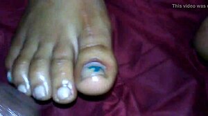 Ebony Delivers Intense Foot Job Leading To Explosive Cumshot