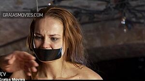 Her hands are tied while she gets caned hard 😱—screaming in pain!