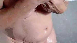 Amateur housewife teases with jerk off instructions in steamy shower session at home.