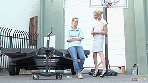 Blonde lesbian comforts stunner with pussy licking in parking lot!