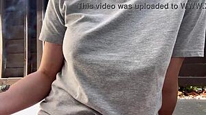 Horny Italian milf with big tits and nipples smokes outdoors in fetish close-up