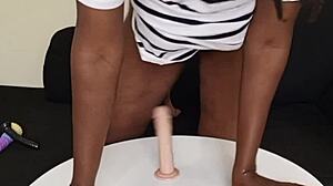 this amateur pornstar rides a dildo in her big tattooed ass during solo homemade cowgirl fun