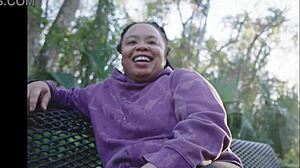 Ebony slut pounds pussy with dildo on public bench