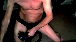 Percussion Massager Applied To Thigh In Underwear On Stool