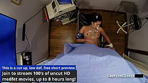 Rebel Wyatt gets captured by government agents who slap her pierced nipples and spread her hairy pussy in latex humiliation.