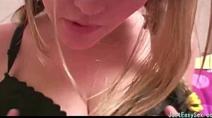 Pigtailed Brunette Gently Plays with Her Big Tits