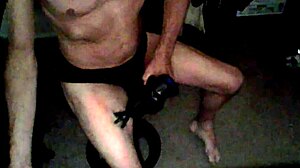 Percussion Massager Applied To Thigh In Underwear On Stool