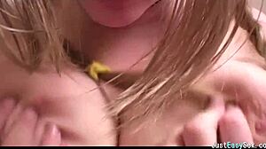 Pigtailed Brunette Gently Plays with Her Big Tits